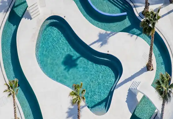 Prepare to indulge in an array of exceptional amenities that redefine the Rocky Point experience.
From Starbucks to a bowling alley, from a driving range and golf simulators to five sparkling swimming pools, including two rooftop pools offers a world of leisure.
Enjoy lazy rivers, thrilling water slides, and dedicated pools for the little ones.
Unwind in one of four jacuzzis, or savor a drink at the expansive U-shaped swim-up bar, basking in the sun on the sundeck. With two clubhouses, a wellness center, a business center, and more, your every desire is catered to.